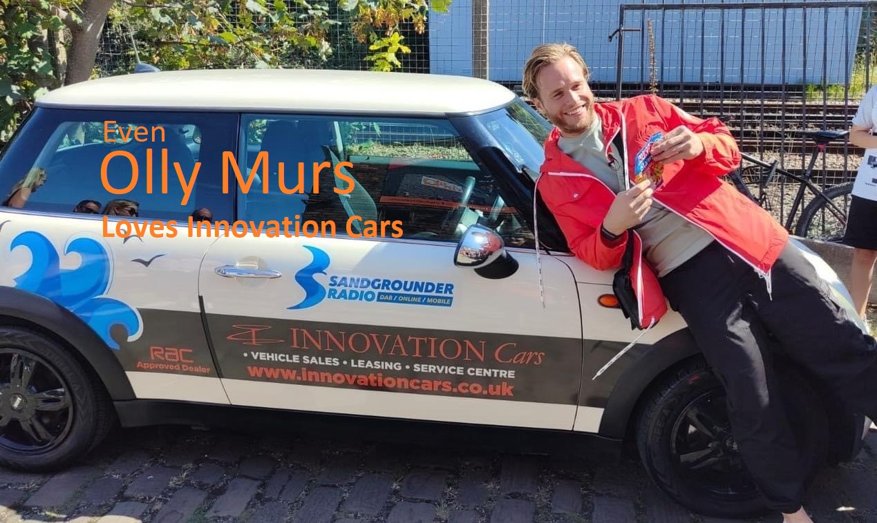 Olly Murs posing next to a car from this dealership whilst holding a packet of sweets
